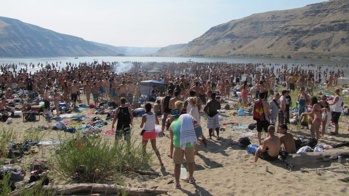 This Snake River beach was packed with people on an August weekend. The party, in 2012, left the area covered with trash, broken bottles and beer cans.