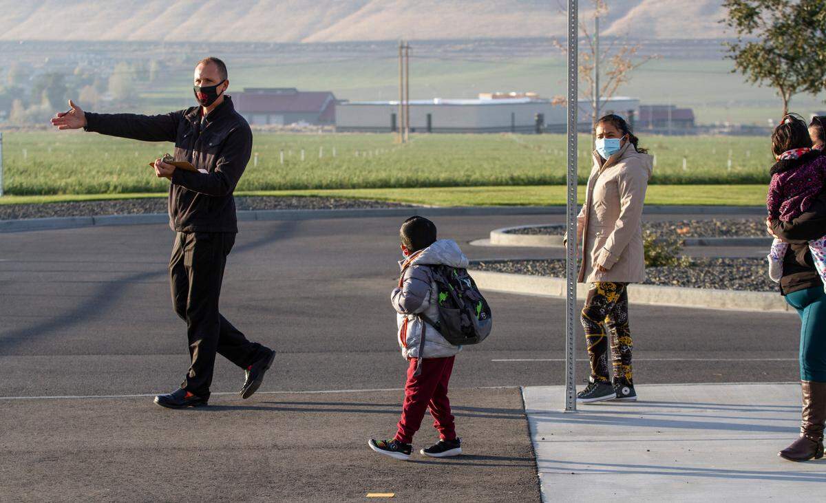 Kindergarten students arrive at Tapteal Elementary in West Richland for in-person classes.