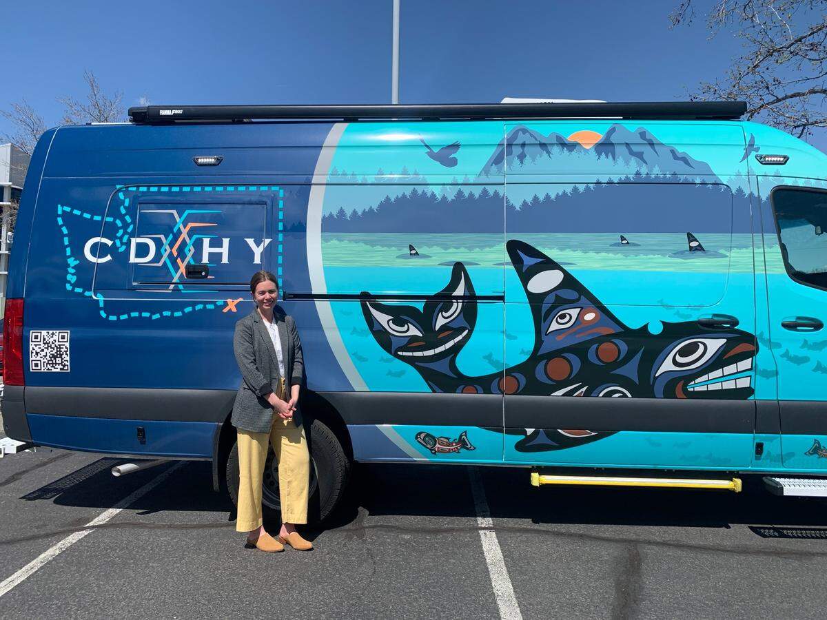 The Educational Service District 123 Director of Audiology, Betsy Schluge, stands in front of the new mobile audiology lab outside the ESD main campus in Pasco, Wash. She drives the van to 23 different Eastern Washington school districts to offer testing and resources to children in underserved areas.