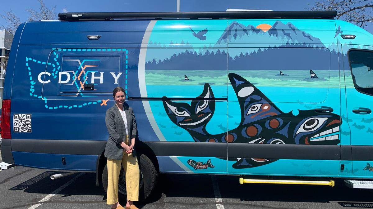 The Educational Service District 123 Director of Audiology, Betsy Schluge, stands in front of the new mobile audiology lab outside the ESD main campus in Pasco, Wash. She drives the van to 23 different Eastern Washington school districts to offer testing and resources to children in underserved areas.