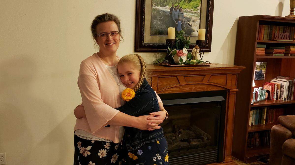 Connie Snodgrass holds her daughter, Madelyn Grace, who was only three weeks old when her mother was placed on life support due to a rare cancer.