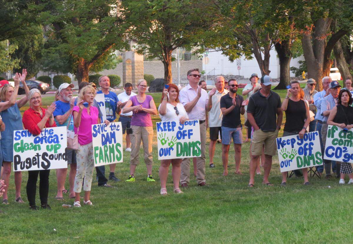 More than 100 people rallied Monday night at Howard Amon Park in Richland in opposition to breaching the four lower Snake River dams in Eastern Washington.