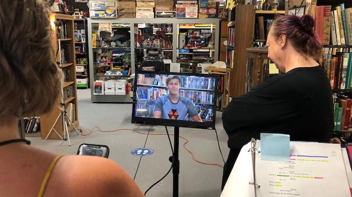 Behind-the-scenes shot from the filming of “Gamma Man,” short film out of 2047 Productions, at Xenophile Bibliopole and Armorer, Chronopolis in Richland.