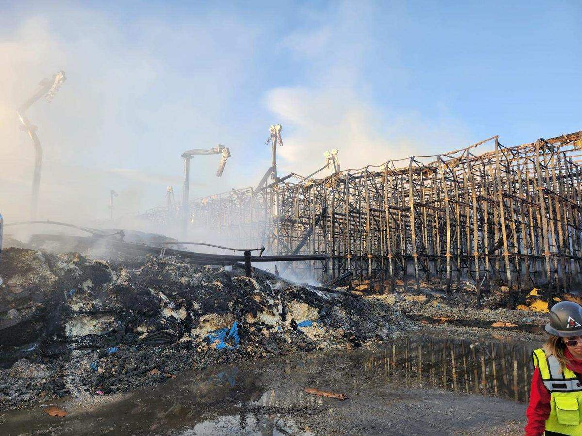 Fire flared up at the Kennewick Lineage cold storage warehouse in strong winds during efforts to put out the fire.