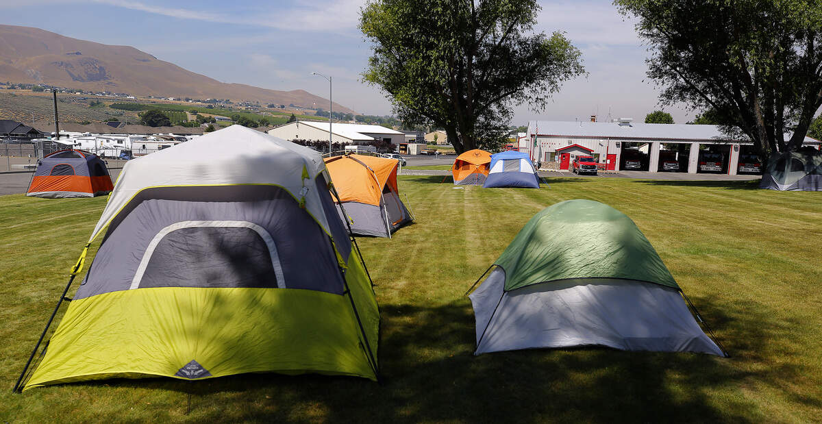 Tents for firefighters cover the grass at Benton County Fire District #2 station 210 at 1304 Dale Ave. in Benton City.