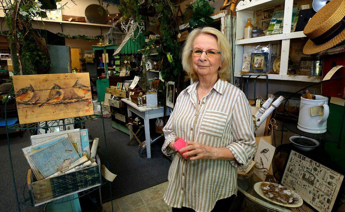 Judy Leung, owner of Patina Antiques and Vintage Finds in the Uptown Shopping Center, is waiting to hear more about the loop project before she forms an opinion one way or another.