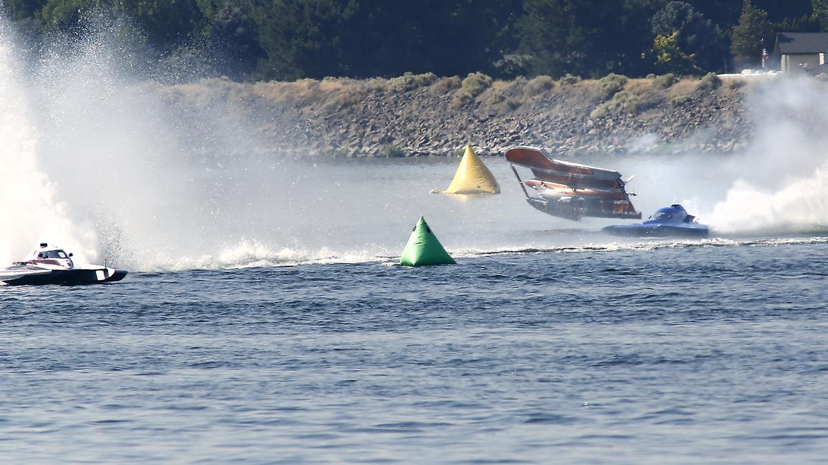 Jim Mauldin, driving the E-31 5-Liter racing hydroplane, flips upside down into the Columbia River at the start of Friday’s heat race at the Columbia Cup race event in Kennewick. Rescue teams raced to the overturned boat and helped get the drive out. It is unknown on the status of Mauldin.