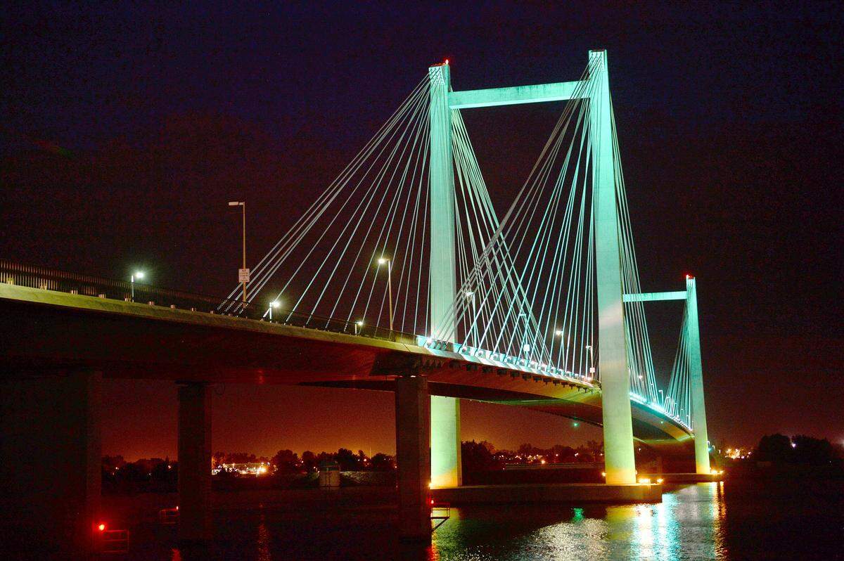 The cable bridge sports teal lights to increase awareness of Ovarian Cancer Awareness Month. 