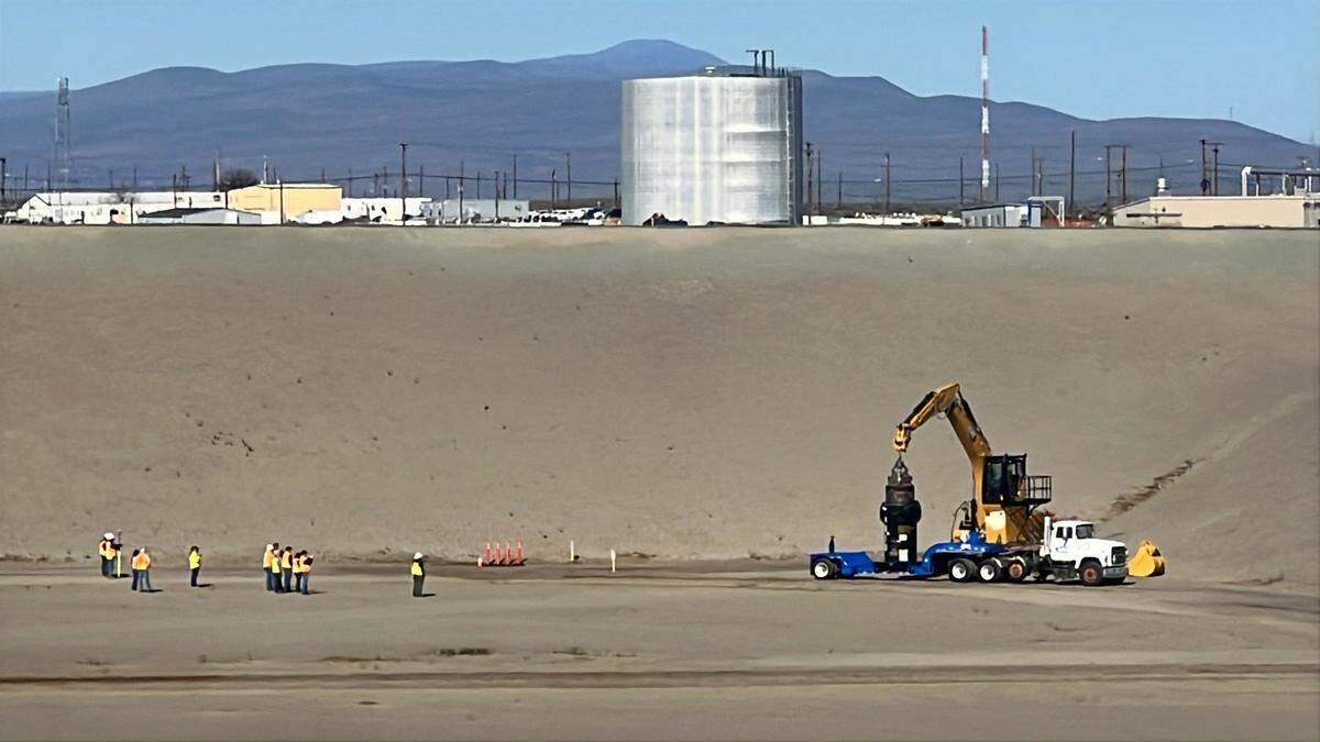 The first container of radioactive waste glassified at the Hanford nuclear site vitrification plant was disposed of in a lined landfill Wednesday.