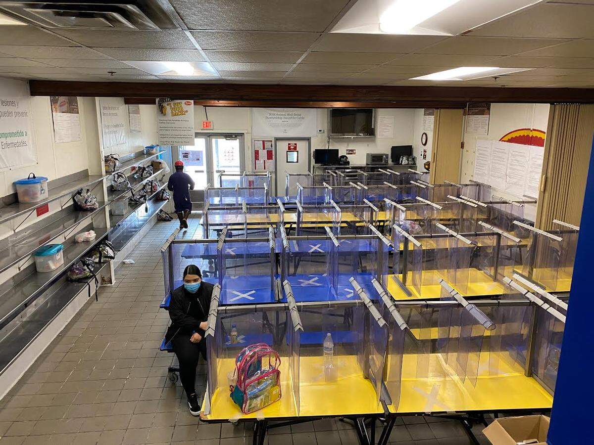 Dividers have been set up in a breakroom at Tyson Fresh Meats south of Pasco with markings that help workers use every other spot at tables to maintain social distancing.
