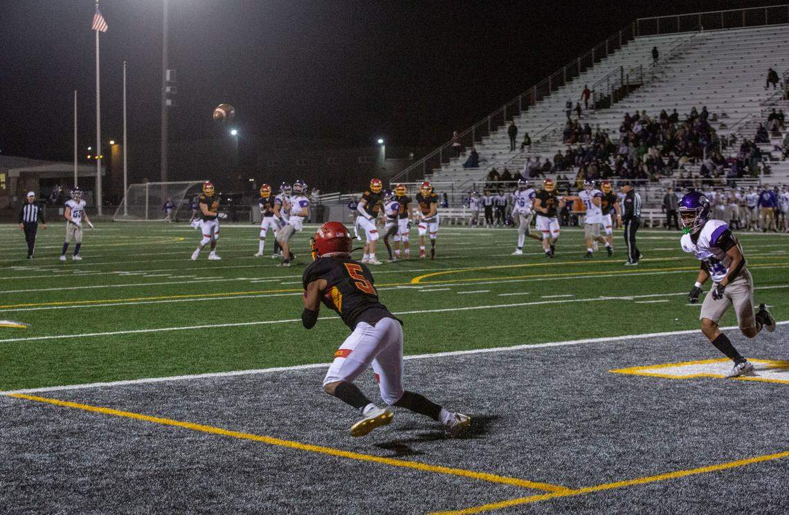 Kamiakin quarterback Henry Mercado passes to senior Aidan Canada for another touchdown in the 4th quarter of the playoff game against the North Creek Jaguars at Lampson Stadium in Kennewick. The Braves blew past the Jaguars with a 56-21 victory.
