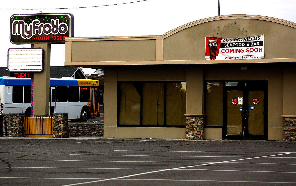 A sign on the former MyFroYo business advertises for a new restaurant called Los Potrillos Seafood and Bar at 2500 W. Kennewick Ave.