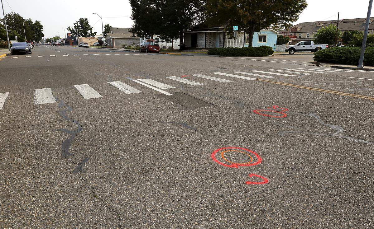 Investigative paint marks the roadway where pedestrian Lorenzo Ayohua-Ramos was fatally struck on West Clark Street near the crosswalk at North Sixth Avenue in Pasco. 