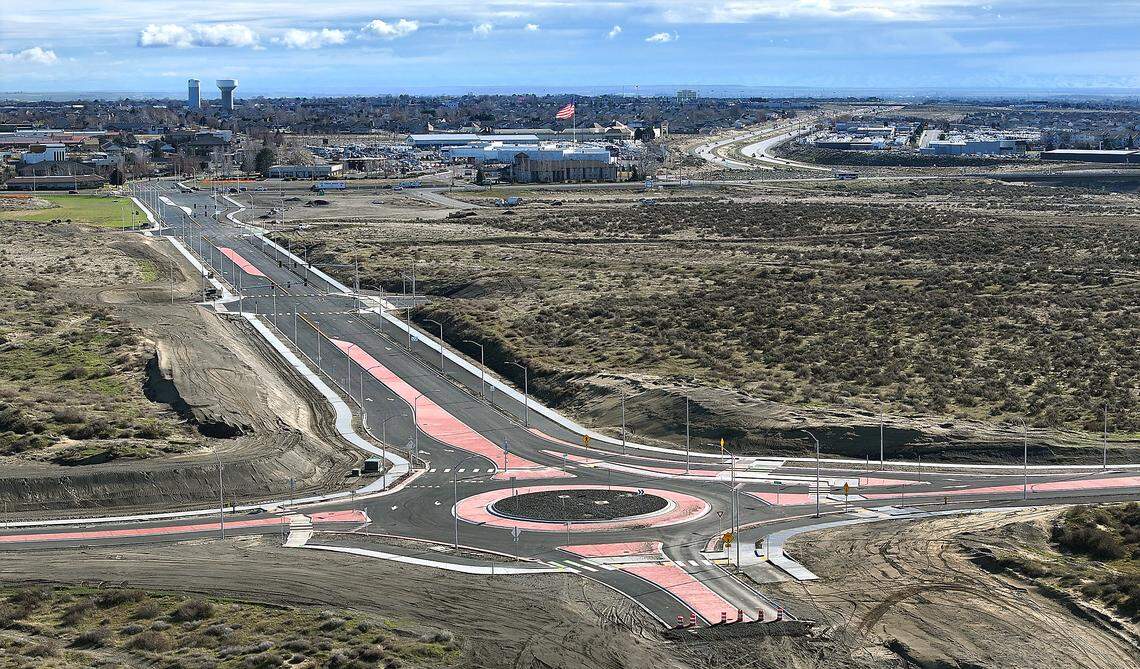 The recently paved section of Sandifur Parkway connects to Road 108 at a roundabout  in west Pasco near the I-182 Road 100 interchange.