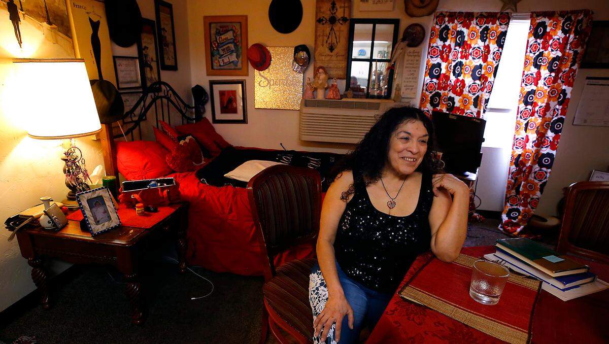 Recovering addict Diane Alaniz Anzar sits in her warmly decorated supportive housing studio apartment in downtown Kennewick. She is celebrating over 2 years of being sober and credits her success to the help she received through the Tri-City Union Gospel Mission.