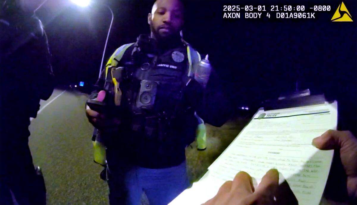 Richland Police officer Steve Heid points out a misspelled word on Sarah Clasen’s written statement form to other officers during his investigation of the March 1 fatal collision.
