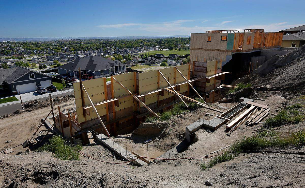 Two view lots with multi-story homes under construction on Hershey Lane in West Richland with price tags in the $860,000 range.