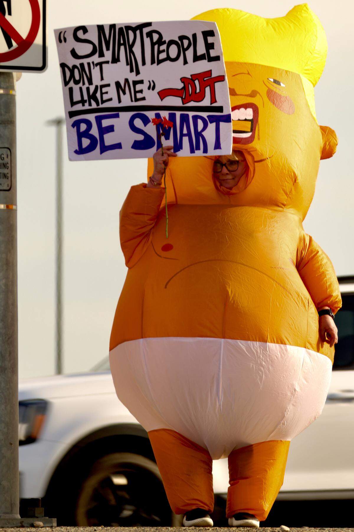Hundreds protested President Trump and federal immigration efforts in the wake of a Minnesota mother’s death this week.