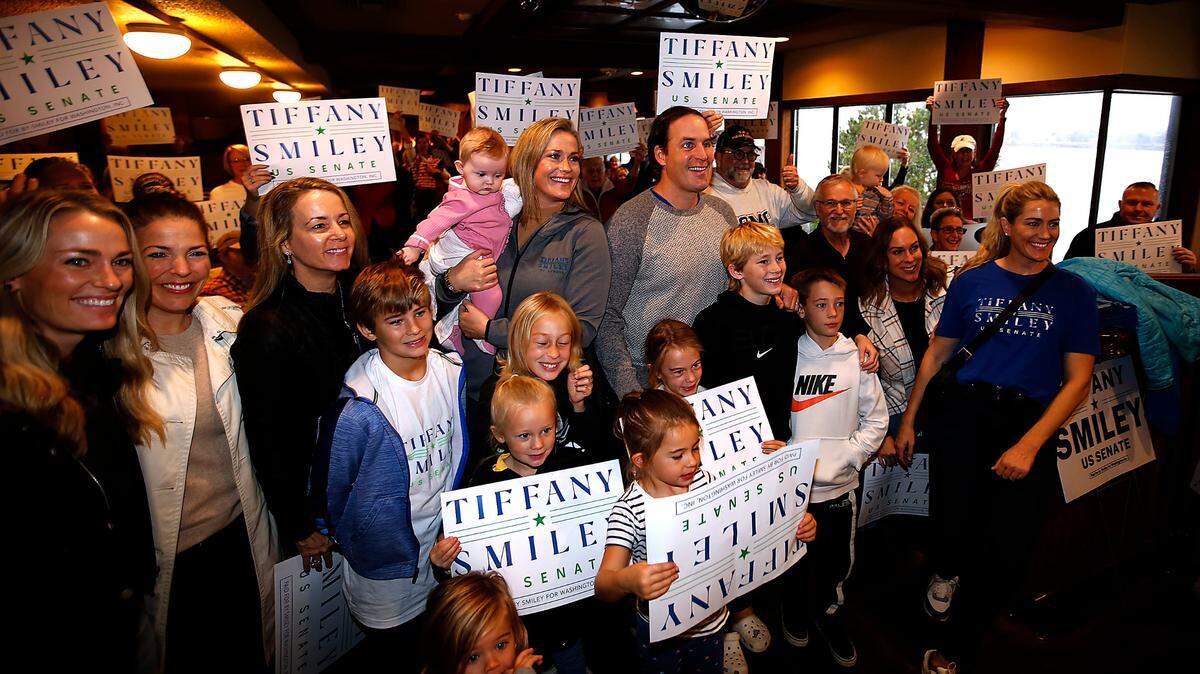 4th Congressional District candidate Tiffany Smiley stands next to her husband, Scott, and family, friends and supporters during her 2022 campaign for the Senate.