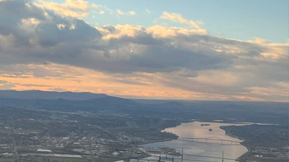 This file photo, taken from an airplane descending into the Tri-Cities airport shows the Columbia River between Kennewick and Pasco in February 2022.