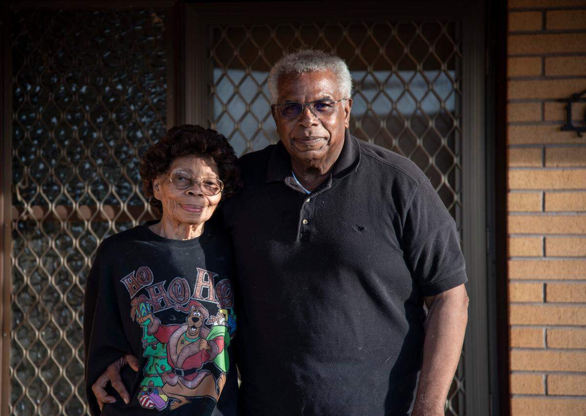Dallas and Lozie Barnes stand on the front porch of their home in Pasco in 2020.