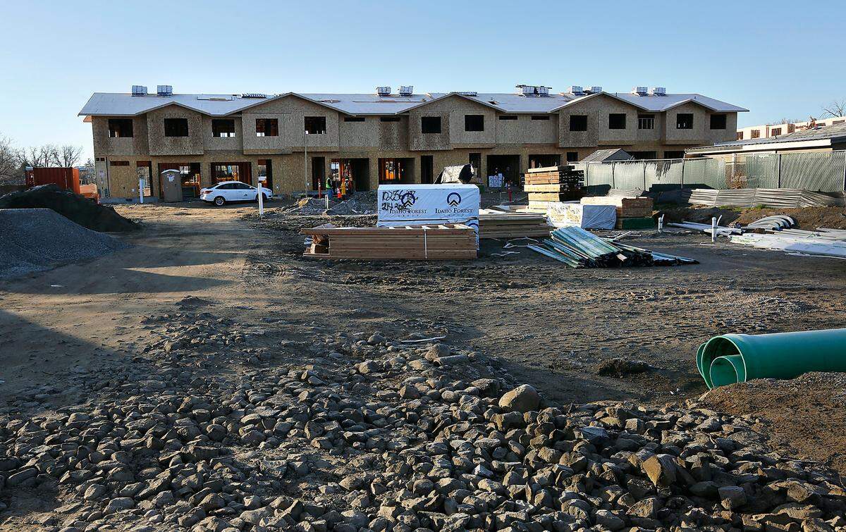 Construction crews work at 911 West Entiat Avenue on the estimated $6.5 million construction project of 36 townhomes on 2 acres of land that once held a single family home built in 1972. The property, zoned high density residential, was purchased several years ago for $384,000 by Kennewick masonry company PMI, Inc. whose work can be found throughout Tri-Cities.