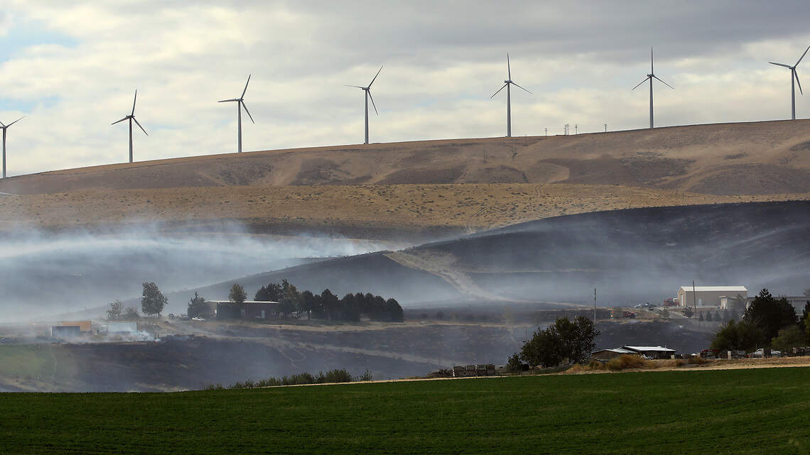 Homes evacuated, Highway 397 closed south of Finley as gusting winds drive wildfire