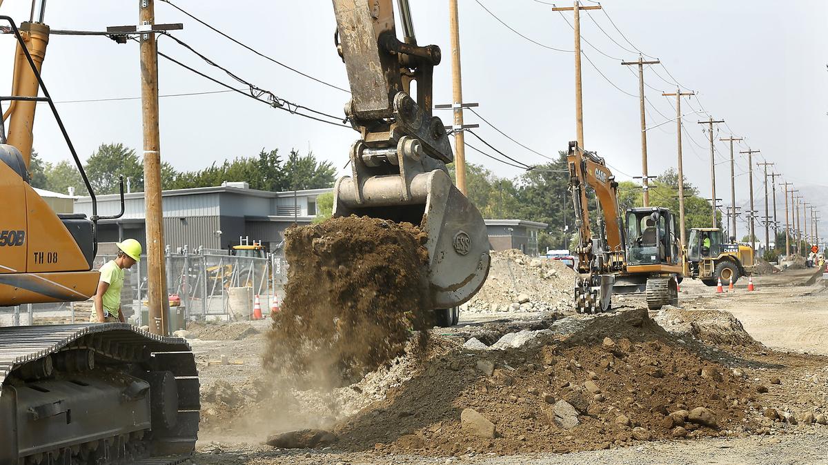 Construction workers and heavy equipment work Friday on the $2.1 million dollar reconstruction project of of West Metaline Avenue in Kennewick. The stretch of road from North Kellogg Street to North Edison Street is currently closed to traffic for the work. The road widening project includes installation of utilities, street lights, curbs, gutters, sidewalks, traffic control, bike lanes and pedestrian ramps.  Half of the funding is coming from federal grant dollars, according to city officials. Completion is expected by November.