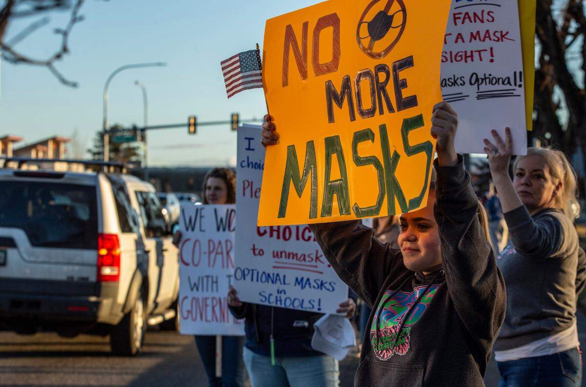Supporters of Richland School Board’s Tuesday night decision to end the school mask mandates lined George Washington Way in Richland to promote mask choice in schools.