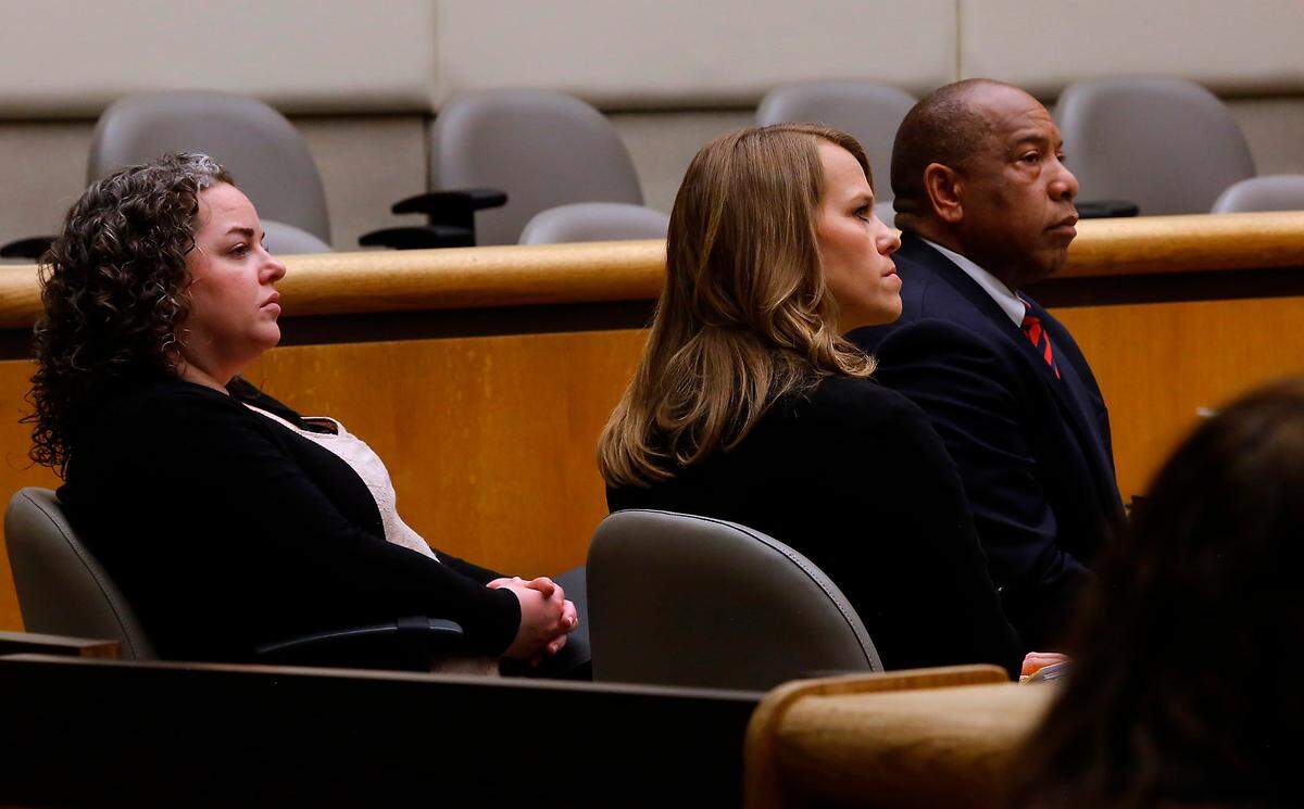 Richland School Board members Kari Williams, Audra Byrd and Semi Bird, from left, listen Wednesday morning to the arguments by both attorneys involved in the recall petition against them in Benton County Superior Court.