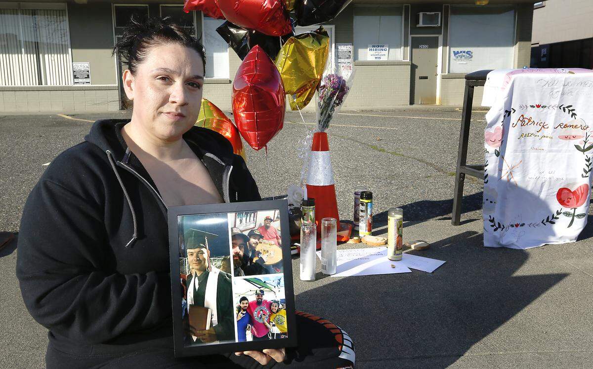 Patricia Martinez holds a framed photo of her nephew, Patrick S. Romero, who was shot and killed in Kennewick last weekend. The Sunnyside High grad would have turned 22 this week. Watch a video at: tricityherald.com/videos