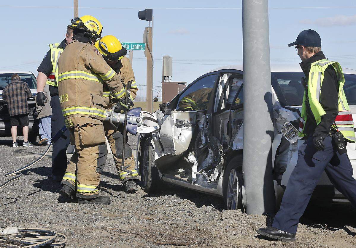 Firefighters from Franklin County Fire District 3 use the Jaws of Life in February to pry open the driver’s door of a late-model Toyota Corolla involved in a two-vehicle crash at the intersection of Glade North and Selph Landing Roads. The fire district is looking to continue collecting property taxes at its current rate.