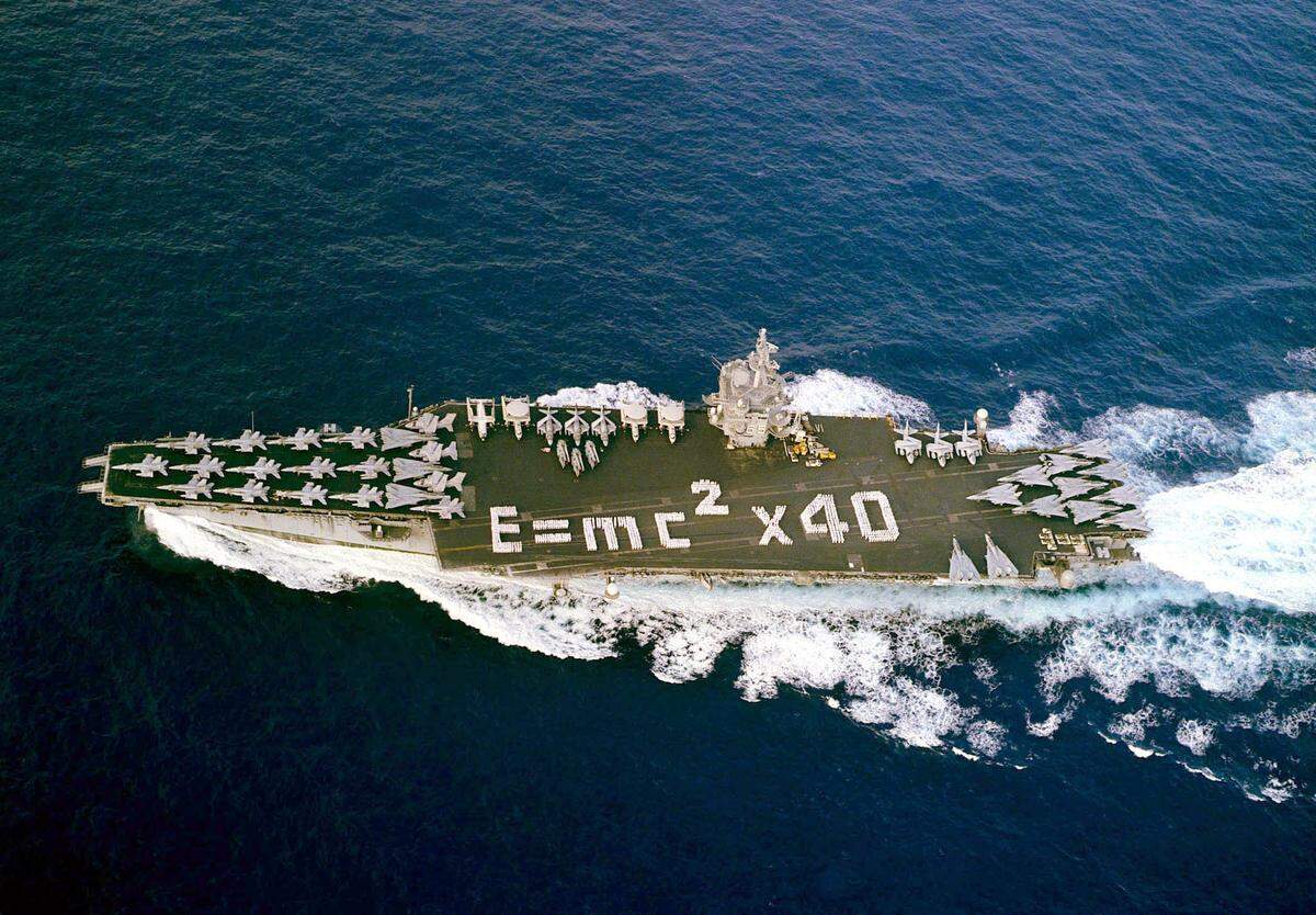 Sailors aboard USS Enterprise spelled out “E = MC2x40” on the carrier’s flight deck to mark 40 years of U.S. Naval nuclear power as ship and crew returned home from a Mediterranean Sea and Arabian Gulf deployment in 2001.