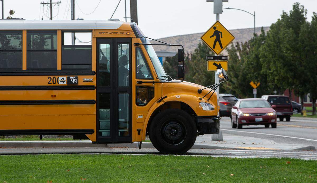 The number 4 has been attached to school buses across the Tri-Cities as a tribute to a slain Pasco bus driver, Dick Lenhart.