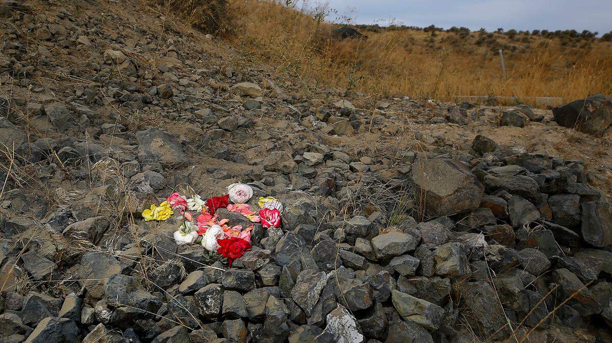 Roses mark the site on East Homestead Road in rural Benton County where the car with six teen girls left the roadway and landed in a ravine killing two of them.. Dennis Morris, Benton County coroner chief deputy, said Mally Bruckelmyer, 16, died before she could be taken to a hospital. and Carma Pekkala, 15, died at Kadlec Regional Medical Center in Richland.