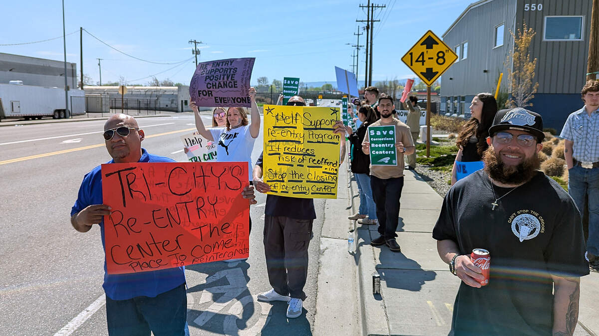 About 50 people rallied April 6 outside the Washington corrections department’s Tri-Cities Reentry Center for prison inmates in downtown Kennewick.