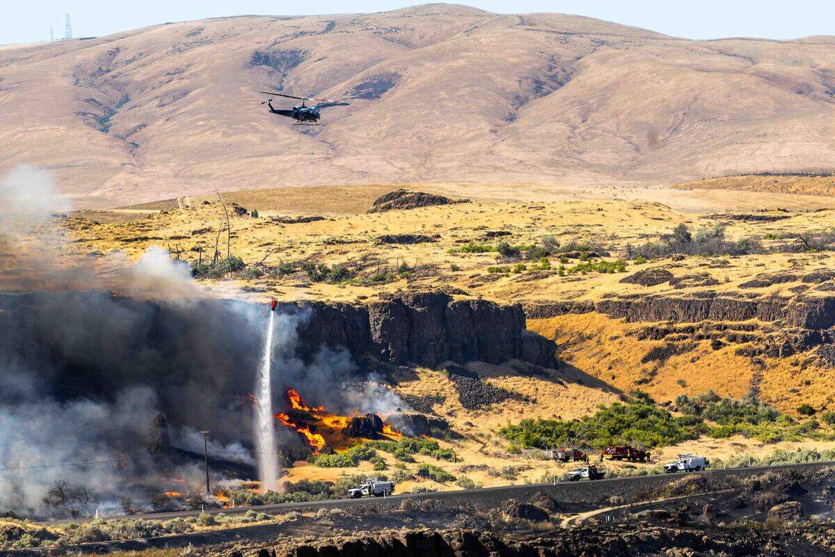 A fire east of Benton City was forcing some residents to be evacuated as it burned near the Old Inland Empire Highway just north of Interstate 82 on Sunday.