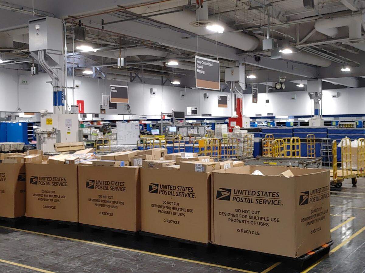 Newly arrived packages await sorting at the Pasco center. The 100,000-square-foot facility recently underwent a high tech modernization project to speed up sorting and improve accuracy.