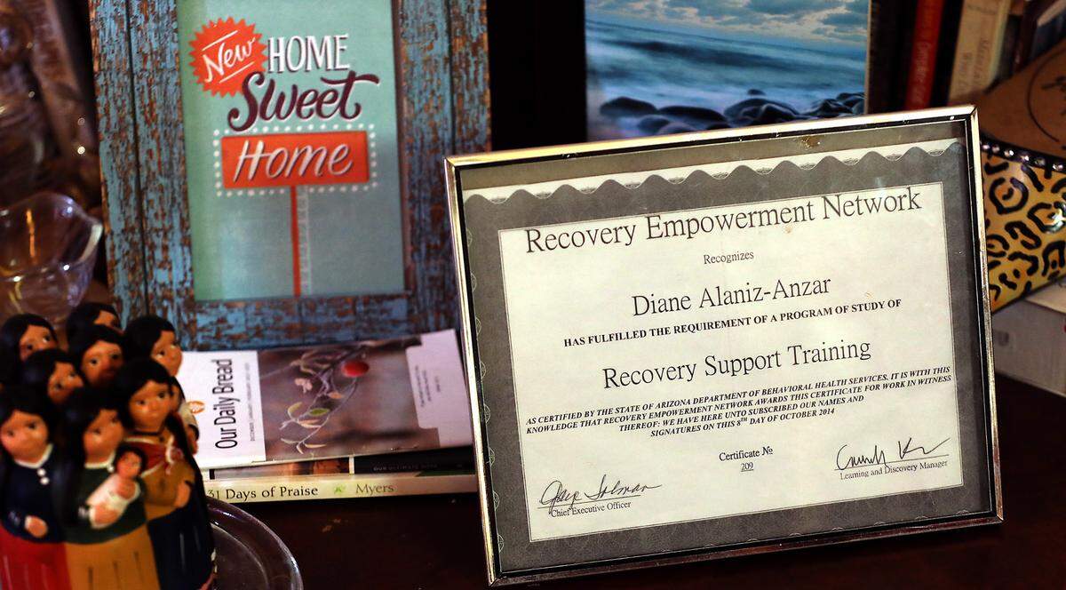 Recovering addict Diane Alaniz Anzar displays a certificate of training she received from the state of Arizona in her supportive housing studio apartment in downtown Kennewick. She says she’s studying to obtain recovery support training in Washington state.