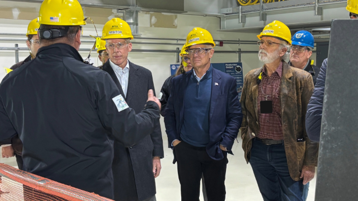 Chris Musick, general manager for the Waste Treatment Completion Co., talks to (left to right) Energy Secretary Chris Wright; Department of Energy Assistant Secretary Tim Walsh; and Rep. Dan Newhouse, R-Wash., Friday Dec. 5 2025 as the energy secretary toured the Hanford nuclear site vitrification plant.