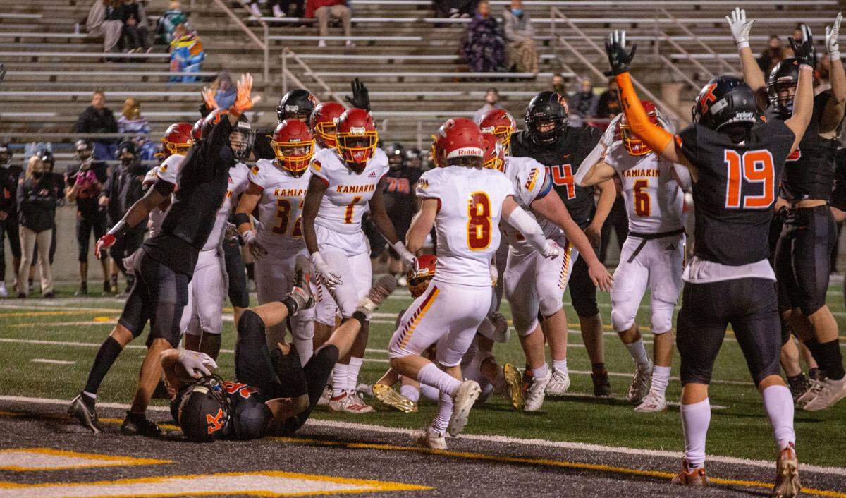 Kennewick running back Myles Mayovsky (18) scores a final touchdown for the Lions in the fourth quarter of the Tuesday night game against Kamiakin at Neil F. Lampson Stadium in Kennewick. The Braves beat the Lions 20-19.