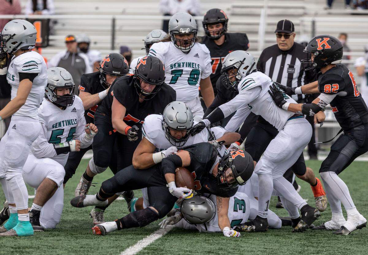 Kennewick Lions senior Myles Mayovsky is tackled by the Spanaway Lake Sentinels defense during the 3rd quarter of the playoffs game at the Lampson Stadium in Kennewick on Saturday.