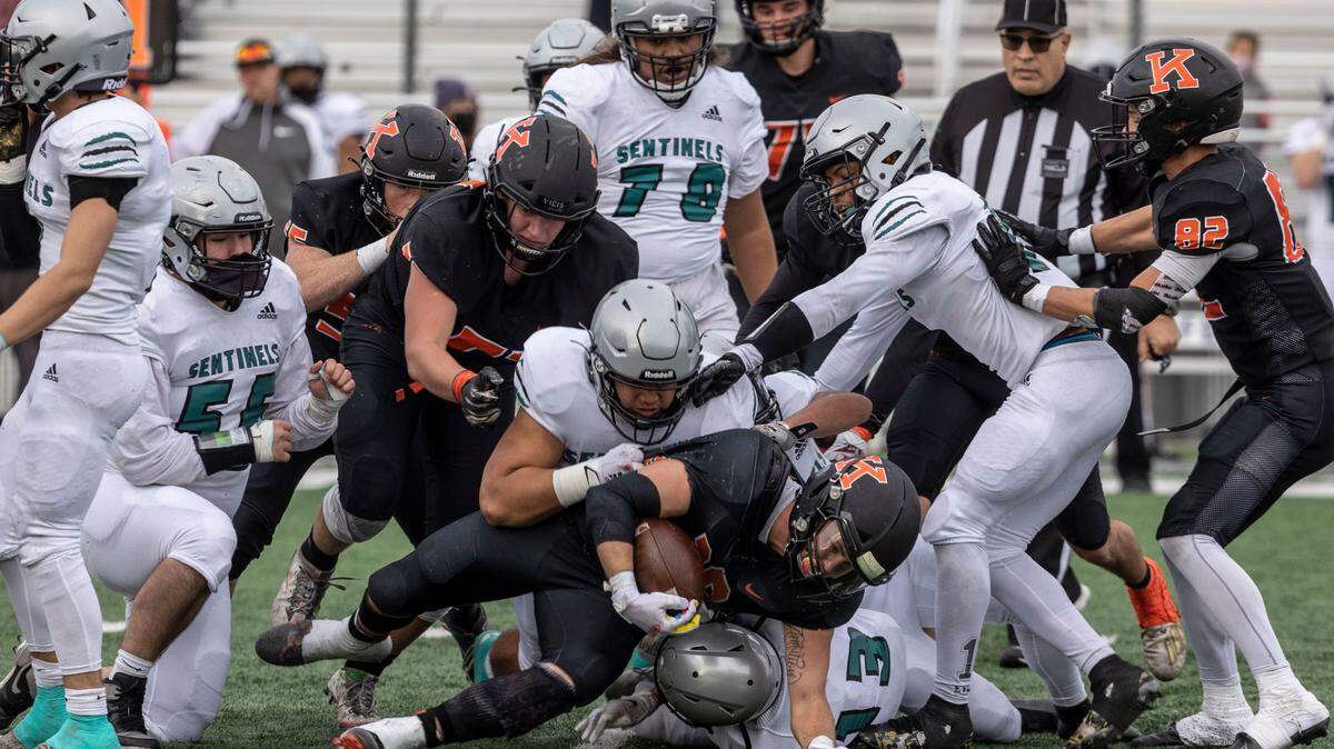 Kennewick Lions senior Myles Mayovsky is tackled by the Spanaway Lake Sentinels defense during the 3rd quarter of the playoffs game at the Lampson Stadium in Kennewick on Saturday. In a stunning 4th quarter play, the Lions beat the Sentinels 26-21.