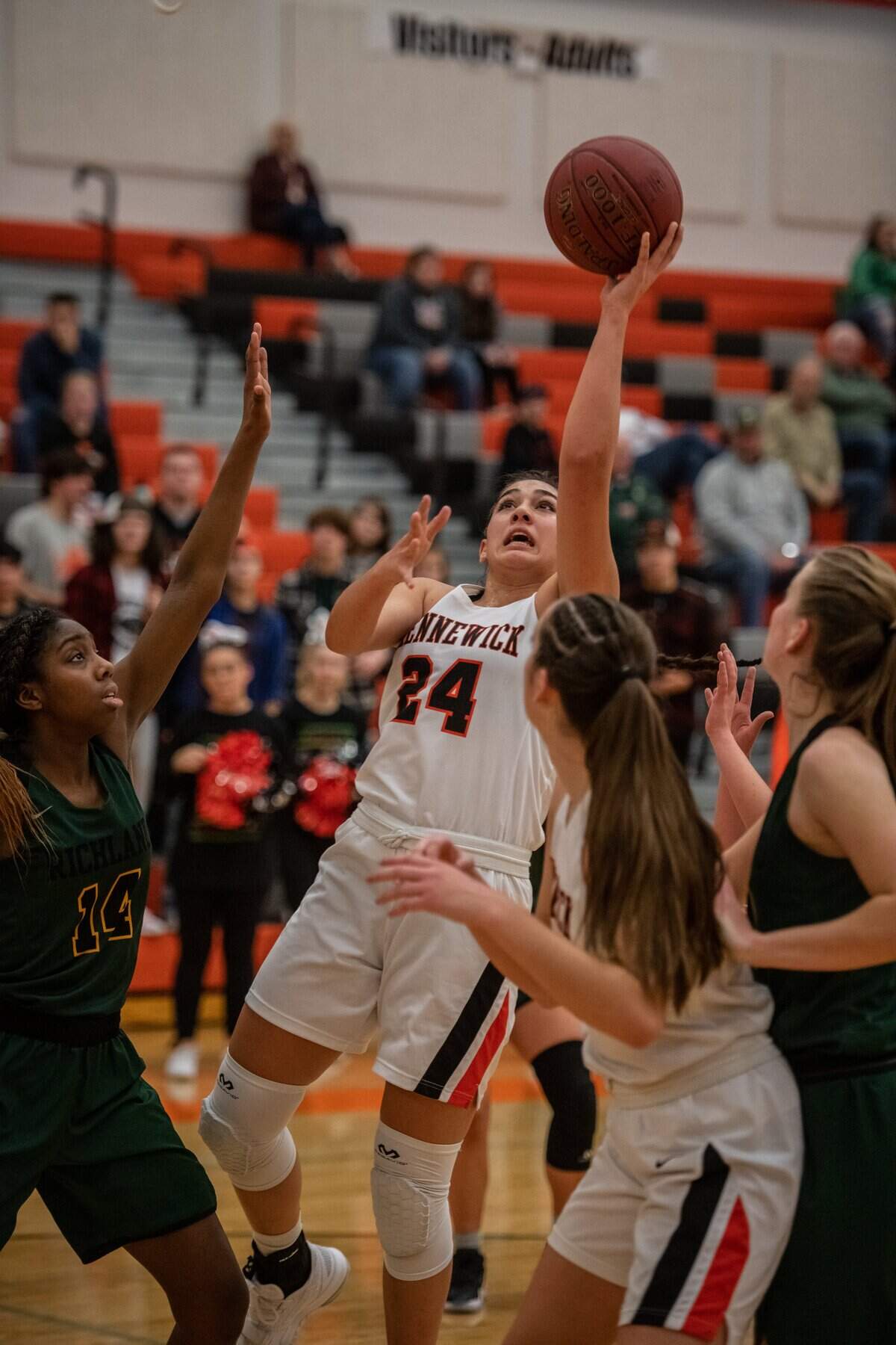 Kennewick’s MeiLani McBee puts up a shot against multiple Richland defenders