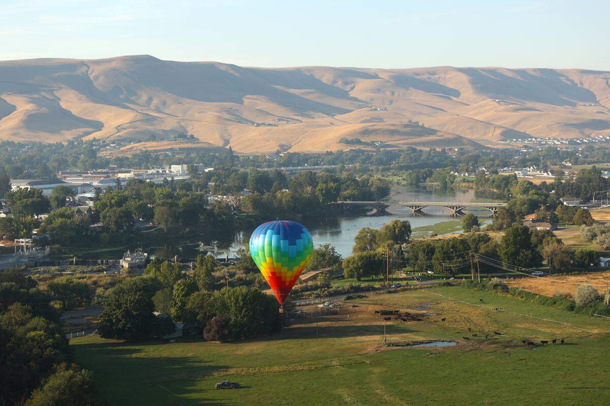 A balloon flies through Prosser during the Great Prosser Balloon Rally Friday.