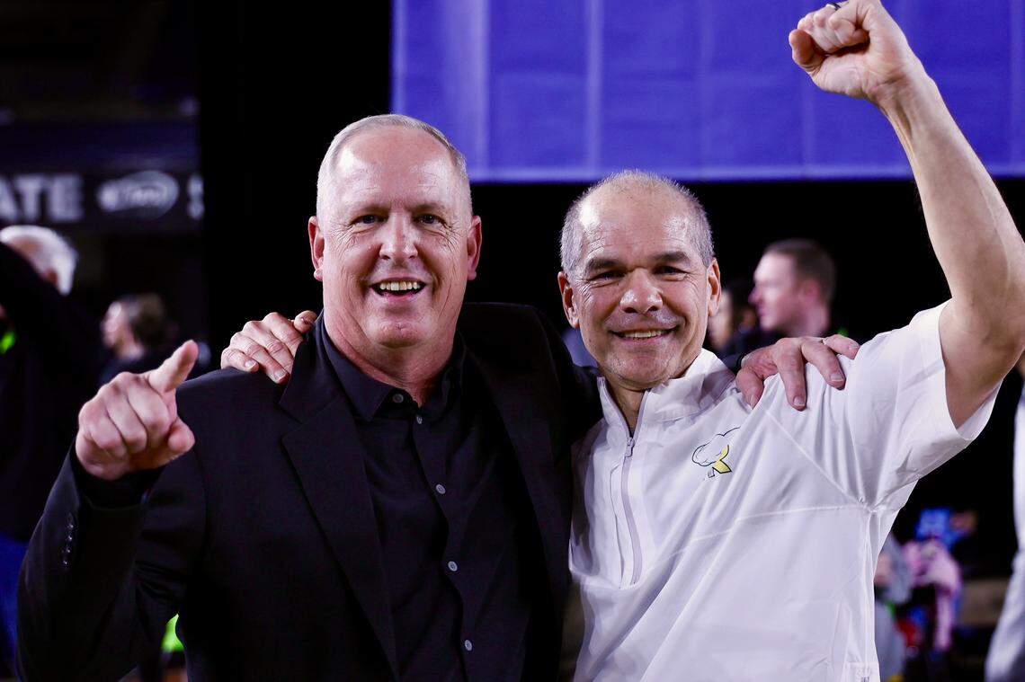Richland head coach Earl Streufert, left, celebrates with assistant coach Bruce Robertson following the Bombers’ 63-49 victory over Gonzaga Prep.