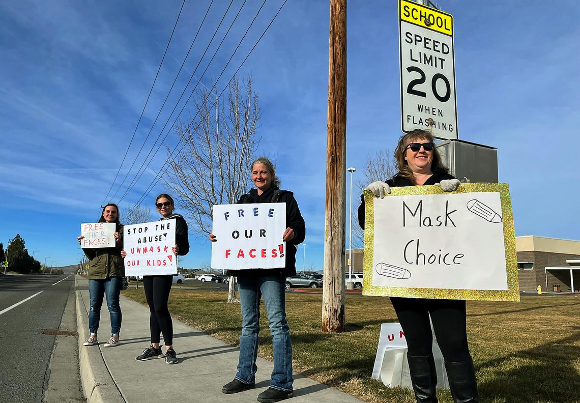 A group of patents protested students needing to wear masks outside of Enterprise Middle School. About two dozen students also participated.