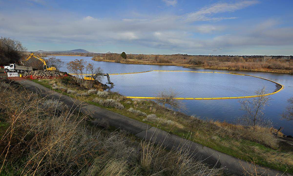 Heavy equipment works on removing the final remnants of the causeway to Bateman Island near the Yakima and Columbia Rivers in Richland. Photo taken Feb. 9, 2026