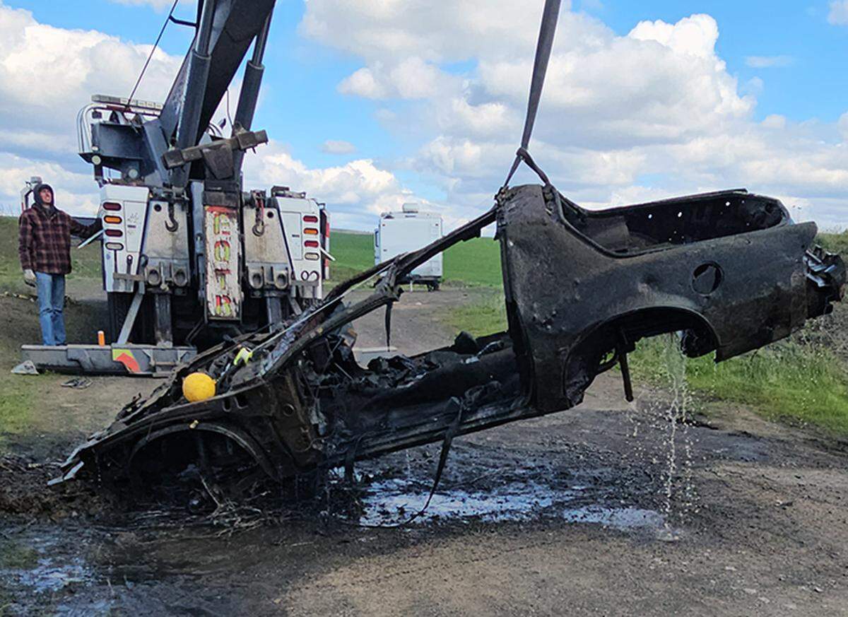 Volunteer divers went into the pond to extract a Ford truck but found the Camaro and Dodge Cummins diesel truck as well.