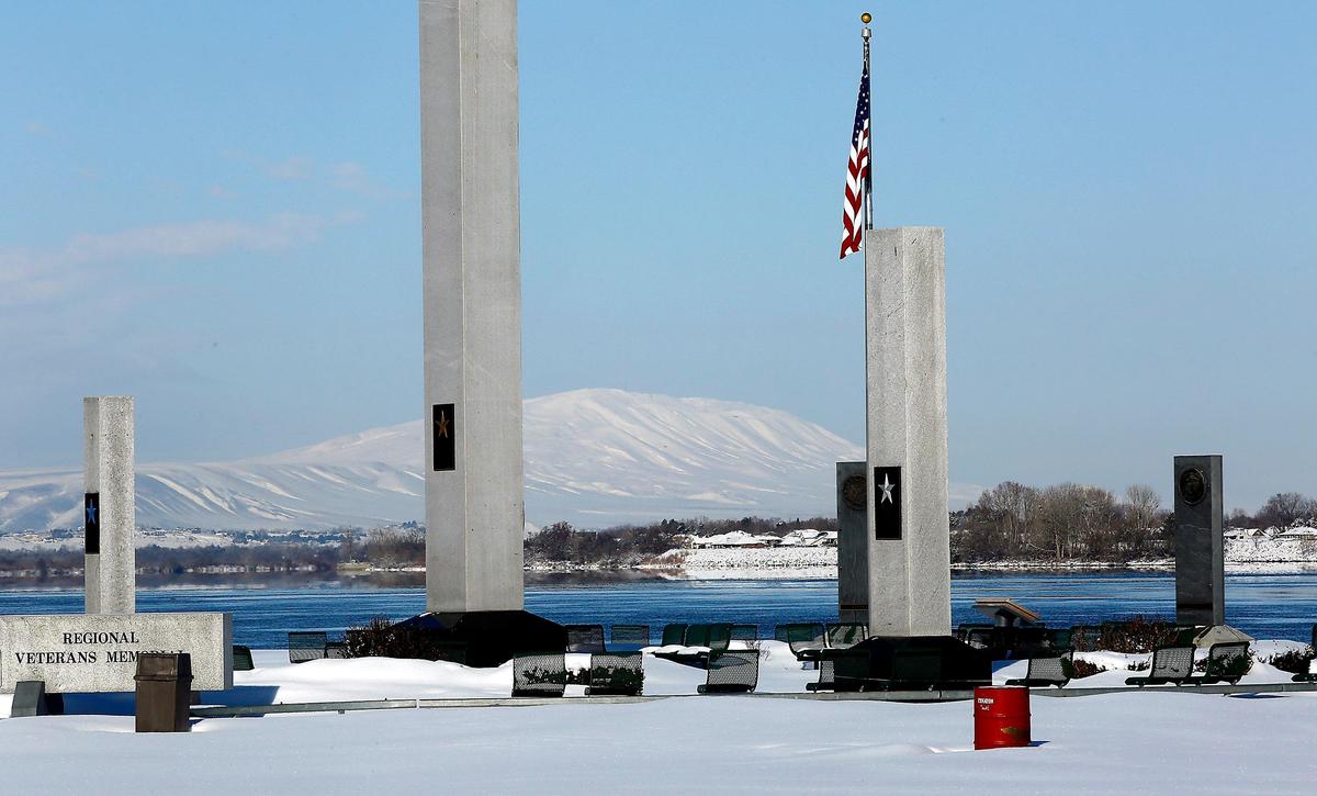 Snow-covered Rattlesnake Mountain provides a picturesque background recently for the Regional Veterans Memorial along the Columbia River in Kennewick’s Columbia Park. More snow is forecast until Thursday morning for the Mid-Columbia.